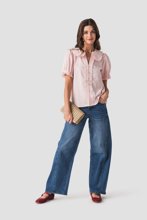 Light pink short puff-sleeve blouse with Peter Pan collar and button front