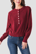 Wine red knit henley sweater front view with half-button placket and long sleeves