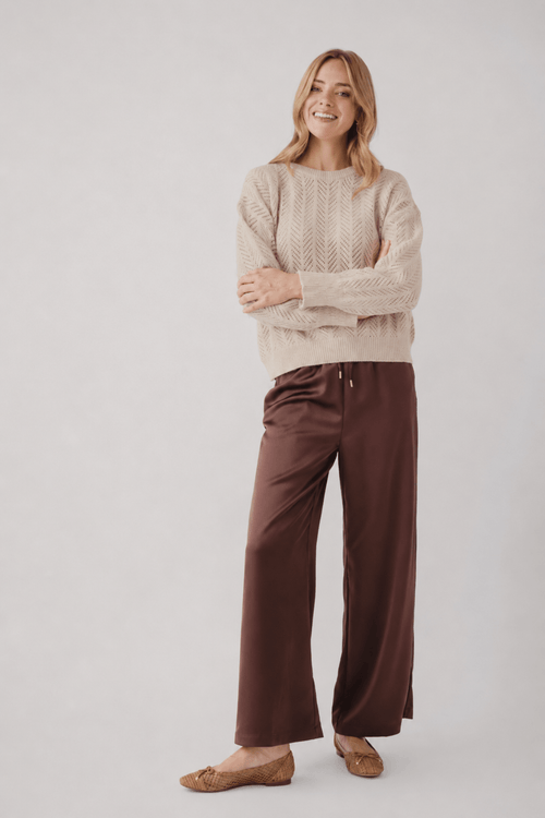 Espresso satin wide-leg pants with relaxed waist and flowing drape