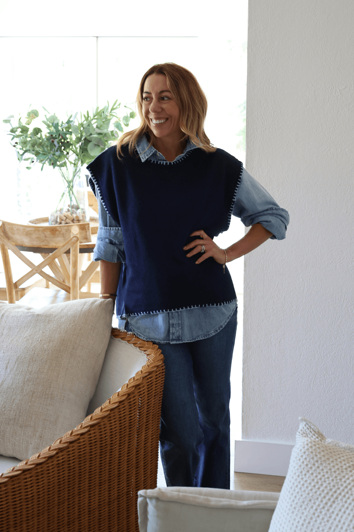Navy blue cap sleeve sweater with blanket-stitched hem detail